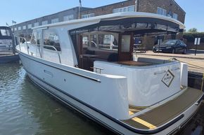 2024 Piper 12c boat docked, showcasing sleek design and modern features.