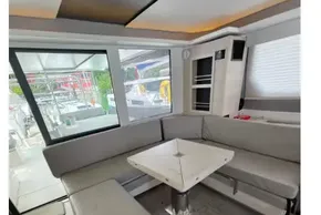 Modern interior of 2020 Leopard 50 yacht with sleek seating and table.