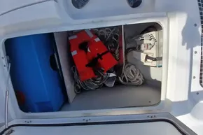 Storage compartment on a 2020 Lagoon 46 yacht with life jacket and ropes.