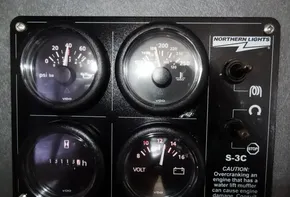 Control panel of a 2015 Leopard 51 Powercat with Northern Lights S-3C gauges.