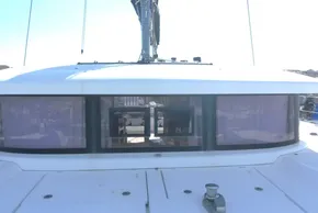 Front view of a 2017 Lagoon 42 catamaran with large windows and deck details.