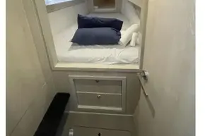 Interior cabin of 2020 Leopard 40 yacht with cozy bedding and modern design.