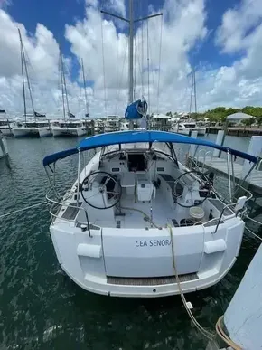2017 Jeanneau Sun Odyssey 519 sailboat docked at marina under blue sky.