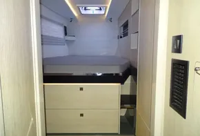 Interior cabin of 2017 Leopard 45 catamaran with modern design and cozy bed.