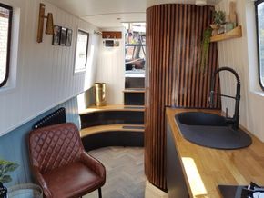 Unique curved rear steps make the most of the boat width on this day boat