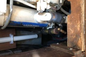 Engine compartment of a 1989 Princess 35 Flybridge boat, showing pipes and fittings.