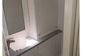 Compact bathroom in a 2018 Leopard 45 yacht, featuring modern fixtures and storage.