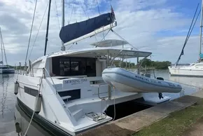Leopard 40 catamaran, 2021 model, docked with dinghy, named 