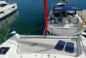 Leopard 45 catamaran, 2019 model, docked with blue cushions on deck.