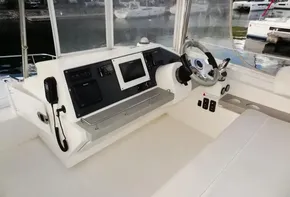Helm station of 2018 Leopard 43 Powercat with navigation equipment and steering wheel.