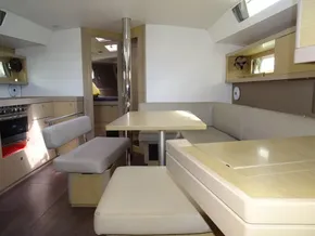 Interior of 2017 Beneteau Oceanis 45 yacht with modern seating and dining area.