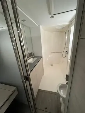 Modern bathroom in 2020 Leopard 50 yacht with shower, sink, and toilet.
