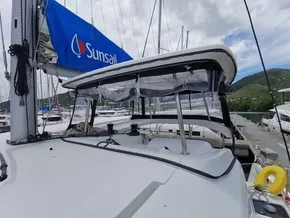 2020 Lagoon 42 catamaran docked, featuring a Sunsail sail and clear canopy.