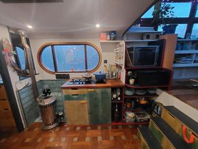 Kitchen cooker area, shelving and diesel heater