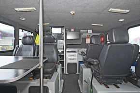 Salon for twelve seated passengers and a small galley