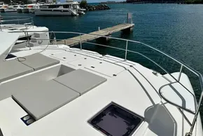 2025 Robertson and Caine Leopard 46 Powercat docked at marina, featuring spacious deck.