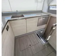 Modern kitchen interior on a 2020 Leopard 50 yacht, featuring sleek cabinetry and stainless steel sink.