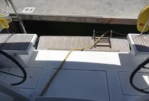 Beneteau Oceanis 46.1 2020 yacht stern view with dock and boarding ladder.