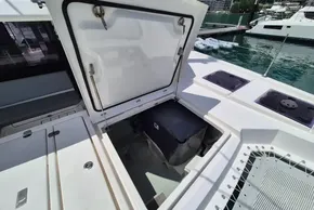 Open storage compartment on a 2021 Leopard 45 catamaran, docked at a marina.