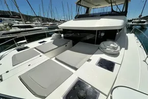 2022 Leopard 53 Powercat yacht with spacious deck and sunbathing area in marina.