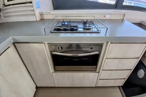 Modern kitchen in 2017 Leopard 48 yacht with stove and oven.