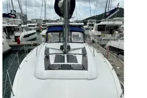 2023 Beneteau Oceanis 51.1 sailboat docked at marina, showcasing sleek deck design.