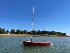Devon Yawl afloat with cover