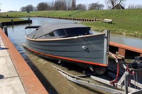 2026 Enkhuizensloep 680 Tender boat on trailer by a canal.