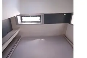 Interior cabin of 2018 Leopard 45 yacht with bed and window.