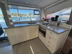 Modern kitchen interior on 2019 Leopard 40 yacht with ocean view and appliances.