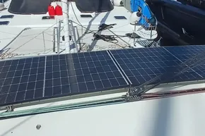 2024 Lagoon 42 catamaran with solar panels on deck, enhancing eco-friendly sailing.