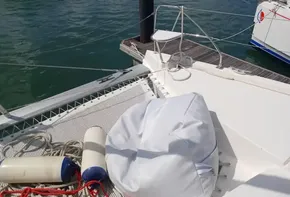 Leopard 40 catamaran deck with ropes and fenders, docked in calm waters, 2021 model.
