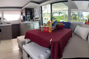 Luxurious 2022 Leopard 45 yacht interior with snacks and drinks on a table.