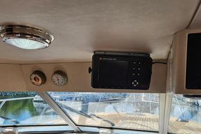 Interior of 1989 Princess 35 Flybridge with chart navigator and gauges.