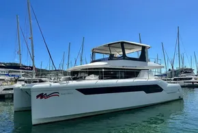 2022 Leopard 53 Powercat yacht docked in marina under clear blue sky.