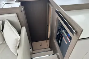 Interior of 2025 Robertson and Caine Leopard 46 Powercat, featuring modern control panel and stairs.