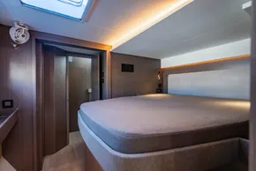 Luxurious interior of 2025 Leopard 46 yacht with modern bedroom design.