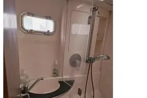 Bathroom interior of a 2008 Leopard 38 yacht with shower and sink.