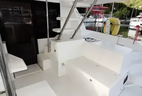 2018 Leopard 43 Powercat boat interior with white seating and storage compartments.