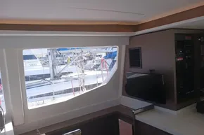 Interior view of 2022 Leopard 45 yacht with window and control panel.