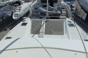 2024 Lagoon 42 catamaran on dry dock, showcasing deck and netting area.