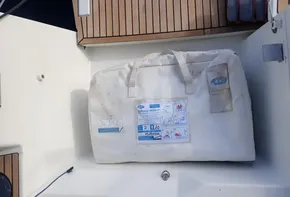 White bag in Jeanneau Sun Odyssey 440 sailboat cockpit, 2019 model.