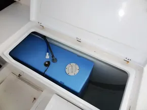 Storage compartment with blue tank in 2018 Leopard 43 Powercat.