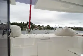 Leopard 45 catamaran deck, 2017 model, with scenic waterfront view.