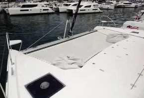 Leopard 50 catamaran (2020) docked in a marina with other boats.