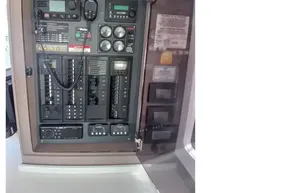 Electrical control panel inside 2022 Leopard 45 yacht, featuring various switches and gauges.