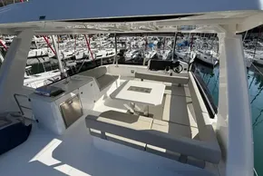 2024 Leopard 40 Powercat yacht interior with seating and helm, docked at marina.