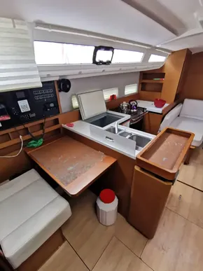 Interior of 2020 Jeanneau Sun Odyssey 410 sailboat with modern kitchen and seating area.