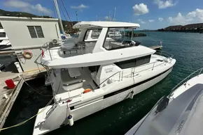 2025 Robertson and Caine Leopard 46 Powercat docked at marina under clear skies.