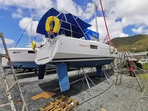 Jeanneau Sun Odyssey 410 sailboat on land, 2020 model, with blue and white hull.